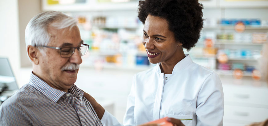 A doctor holds a patients hand