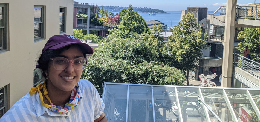 <span>Monica Chakraborty</span> standing on a roofdeck