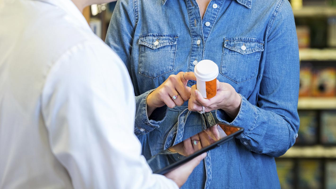 A patient holding a prescription pill bottle