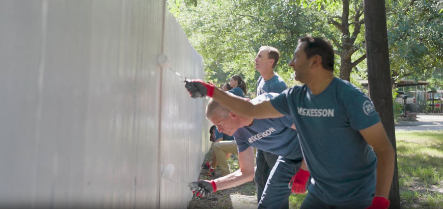 People painting a wall