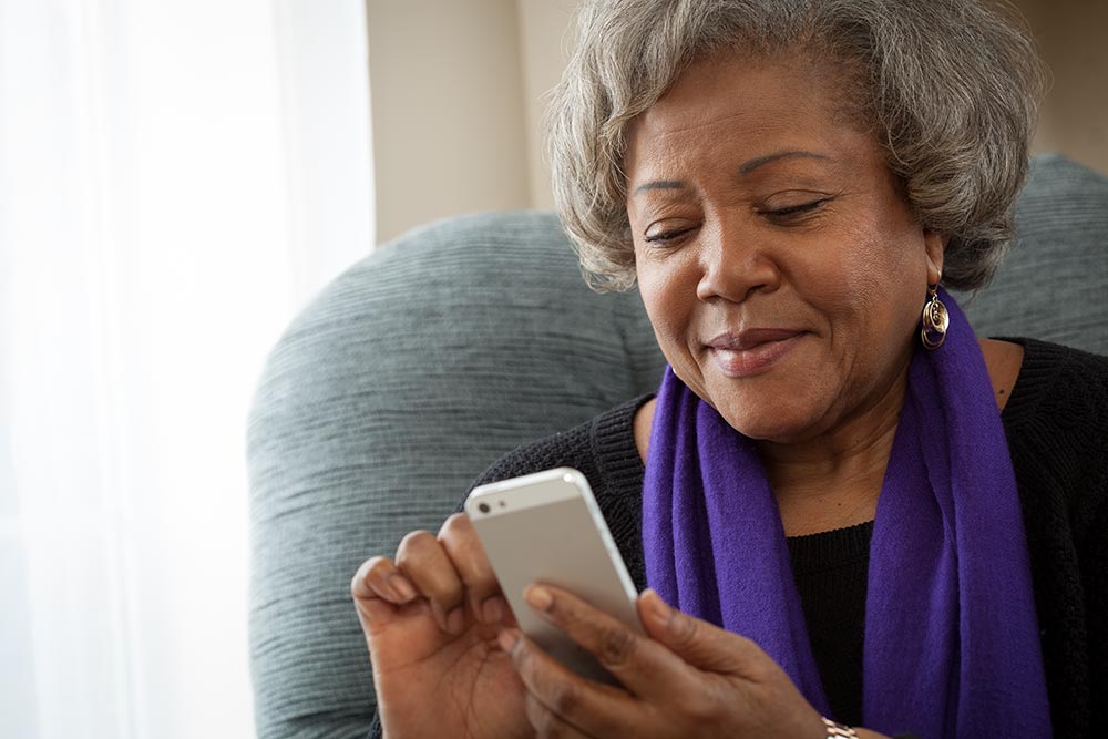 A woman looking at a cell phone