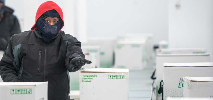 A stack of medication boxes in cold storage