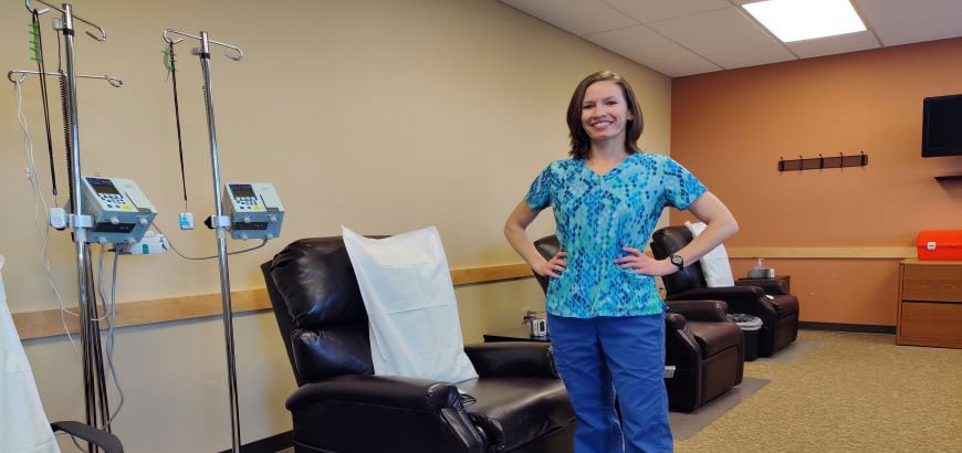 <span>Leslie Dehoyos standing in a hospital room<br>  </span>