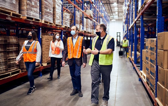 McKesson employees walk through the McKesson warehouse