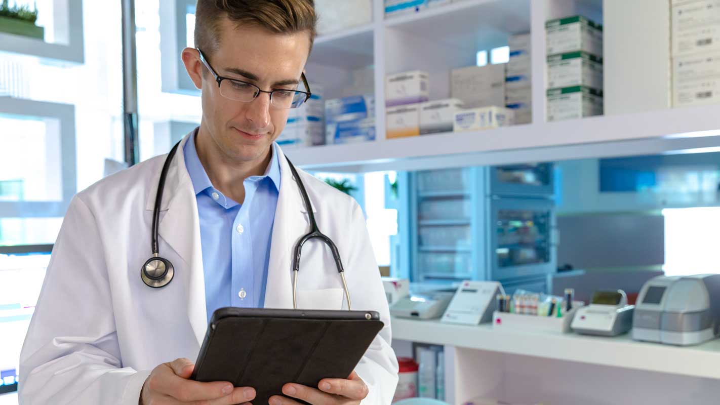 A doctor holding a clipboard