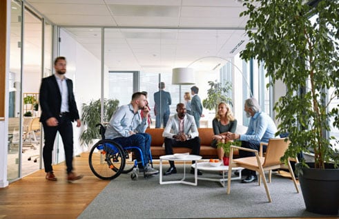 A small group of coworkers having a meeting inside an office