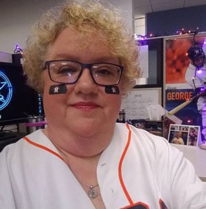 Angela wearing a t-shirt and face paint for the Astros