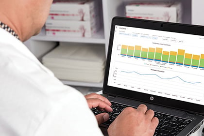 A pharmacist using a laptop